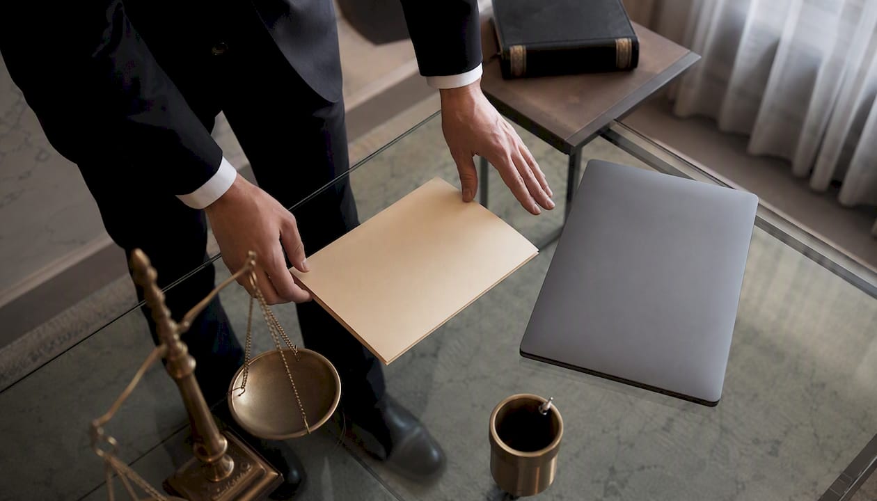 Lawyer hands placing folder on table